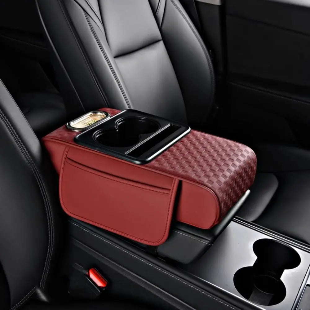 Coussin d’accoudoir de console centrale pour voiture bordeaux avec porte gobelet et distributeur de mouchoirs intégrés.